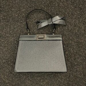 Elegant Silver Handbag with Bow Accent
